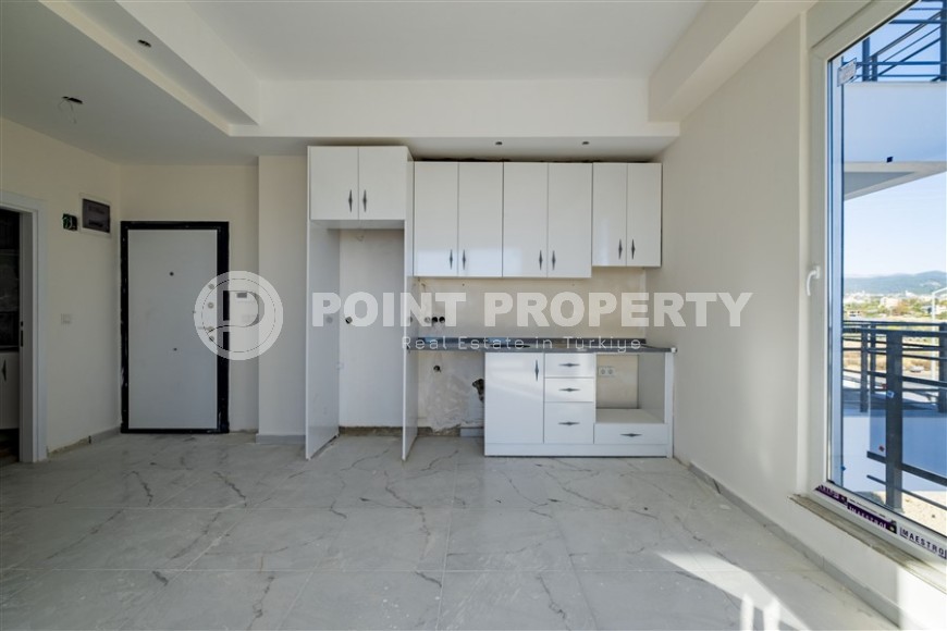 Small 1+1 apartment on the 8th floor in a residence at the final stage of construction.-id-4595-photo-9