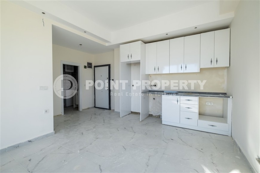 Small 1+1 apartment on the 8th floor in a residence at the final stage of construction.-id-4595-photo-10