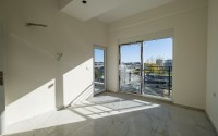 Small 1+1 apartment on the 8th floor in a residence at the final stage of construction.-id-4595-photo-13