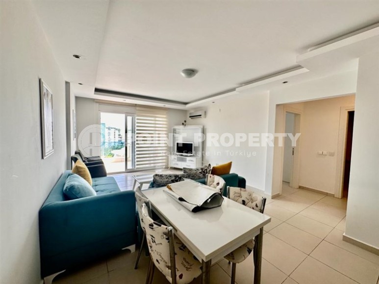 Comfortable 1+1 apartment, with a total area of 55 m2, in the modern area of Alanya - Mahmutlar Description:-id-6982-photo-2