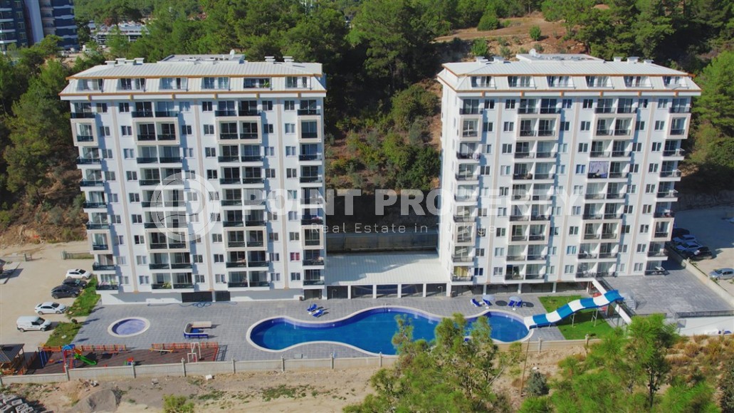 Готовая к проживанию квартира 1+1, общей площадью 50 м2, в перспективном районе Аланьи - Авсаллар-id-6994-фото-15