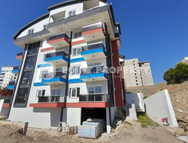 Inexpensive 1+1 apartment, with a total area of 50 m2, 800 meters from the sea, in the Mahmutlar area-id-7027-photo-1