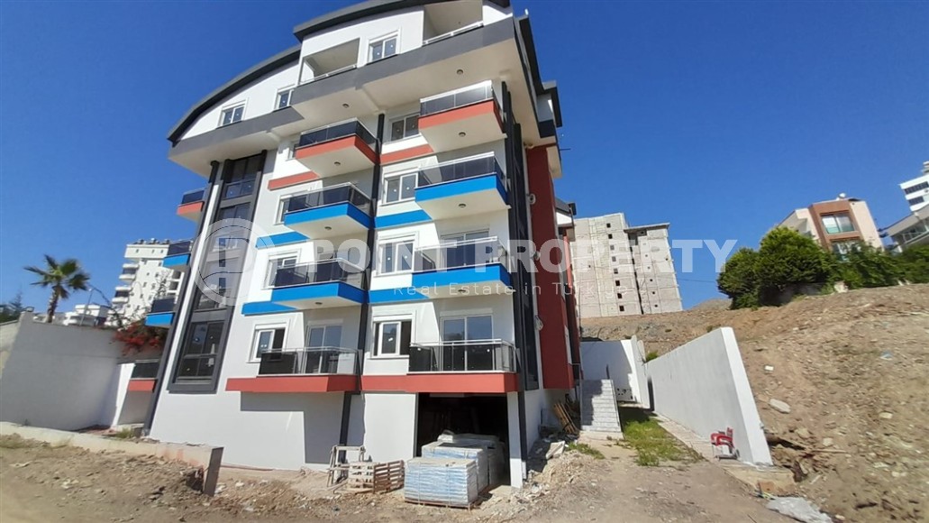Inexpensive 1+1 apartment, with a total area of 50 m2, 800 meters from the sea, in the Mahmutlar area-id-7027-photo-1
