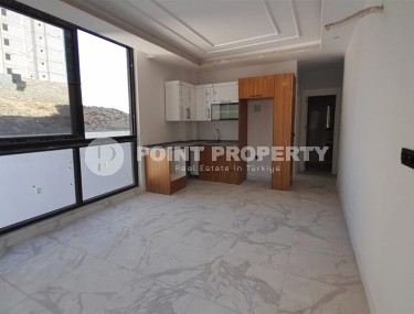 Inexpensive 1+1 apartment, with a total area of 50 m2, 800 meters from the sea, in the Mahmutlar area-id-7027-photo-2