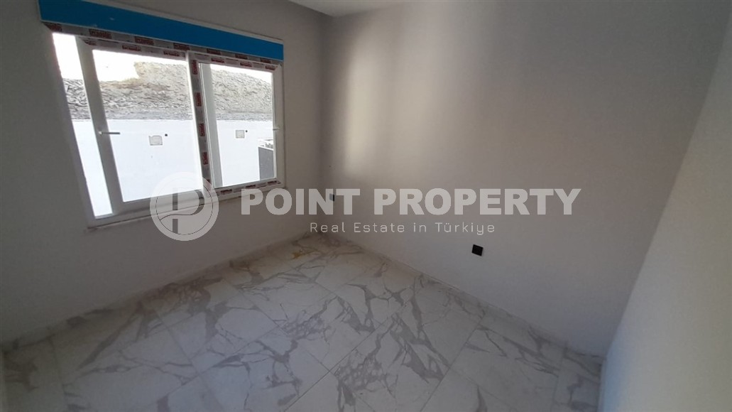 Inexpensive 1+1 apartment, with a total area of 50 m2, 800 meters from the sea, in the Mahmutlar area-id-7027-photo-5