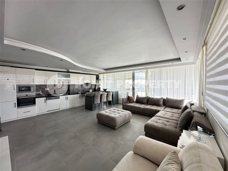 Современная квартира с тремя спальнями и большой открытой террасой, площадью 125 м2, в спокойном районе Аланьи - Джикджилли-id-7030-фото-1