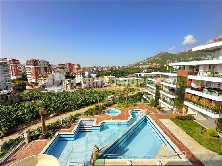 Современная квартира с тремя спальнями и большой открытой террасой, площадью 125 м2, в спокойном районе Аланьи - Джикджилли-id-7030-фото-16