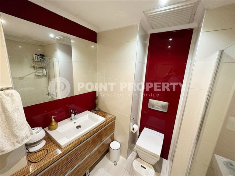 Modern apartment with comfortable furniture and all necessary appliances, one and a half kilometers from the sea, in the center of Alanya-id-7062-photo-11