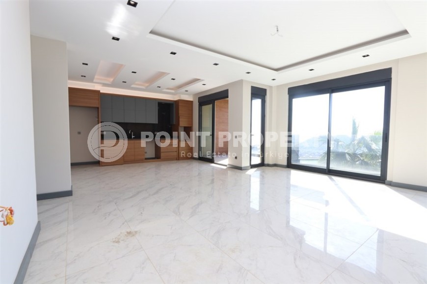 Просторная двухуровневая квартира с собственным садом в элитном районе Аланьи - Тепе-id-7090-фото-2