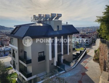Panoramic apartment overlooking the sea and Mount Kale, on the 4th floor with an attic in the prestigious area of Alanya - Hasbahce-id-7094-photo-1