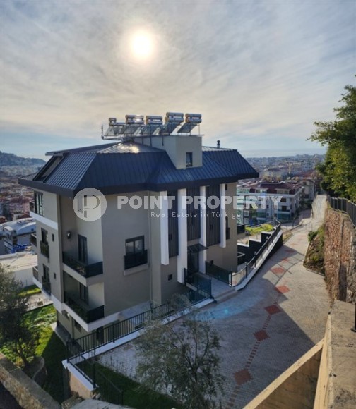 Панорамная квартира с видом на море и гору Кале, на 4-м этаже с мансардой в престижном районе Аланьи - Хасбахче-id-7094-фото-1