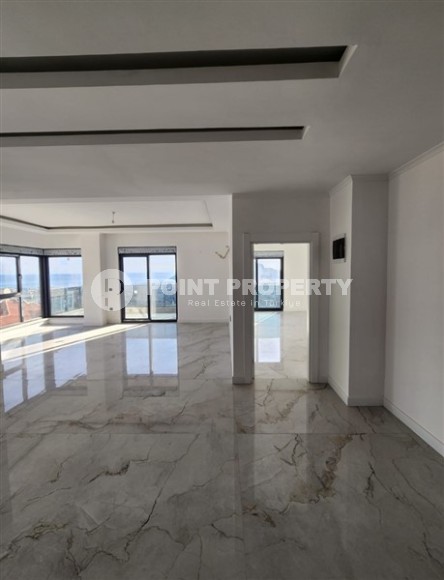 Панорамная квартира с видом на море и гору Кале, на 4-м этаже с мансардой в престижном районе Аланьи - Хасбахче-id-7094-фото-5