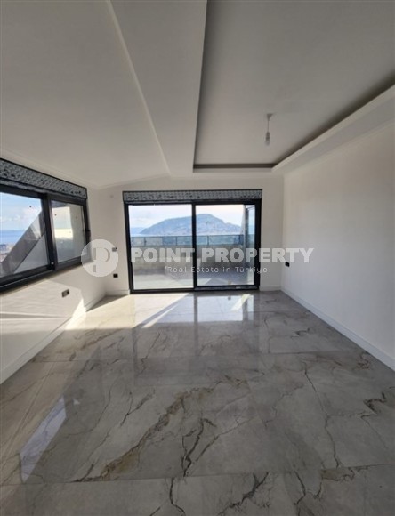 Панорамная квартира с видом на море и гору Кале, на 4-м этаже с мансардой в престижном районе Аланьи - Хасбахче-id-7094-фото-9