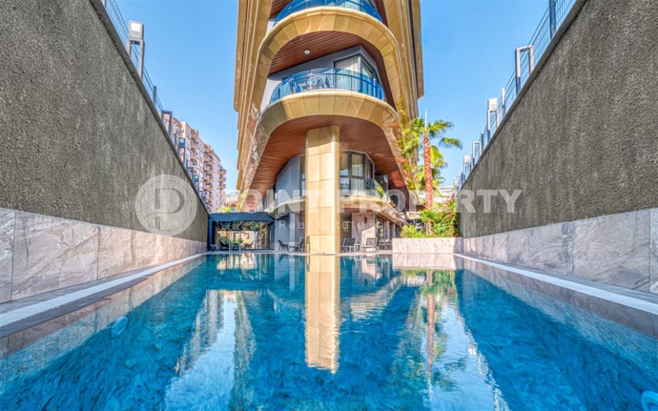 Светлая квартира с качественной чистовой отделкой, в 450 метрах от пляжа Клеопатры, в центре Аланьи-id-7106-фото-18