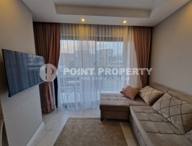 Современная, благоустроенная квартира 1+1, общей площадью 48 м2, в центре спокойного, уютного района Аланьи - Тосмур-id-7119-фото-2