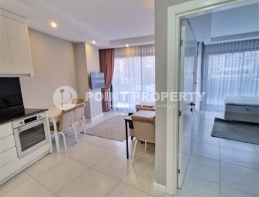 Современная, благоустроенная квартира 1+1, общей площадью 48 м2, в центре спокойного, уютного района Аланьи - Тосмур-id-7119-фото-3