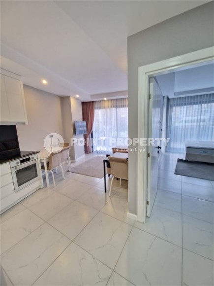 Современная, благоустроенная квартира 1+1, общей площадью 48 м2, в центре спокойного, уютного района Аланьи - Тосмур-id-7119-фото-3