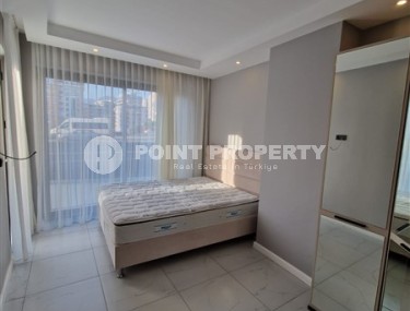 Современная, благоустроенная квартира 1+1, общей площадью 48 м2, в центре спокойного, уютного района Аланьи - Тосмур-id-7119-фото-4