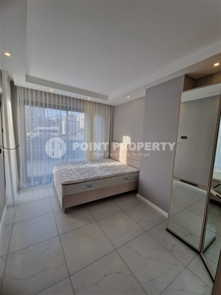 Современная, благоустроенная квартира 1+1, общей площадью 48 м2, в центре спокойного, уютного района Аланьи - Тосмур-id-7119-фото-4