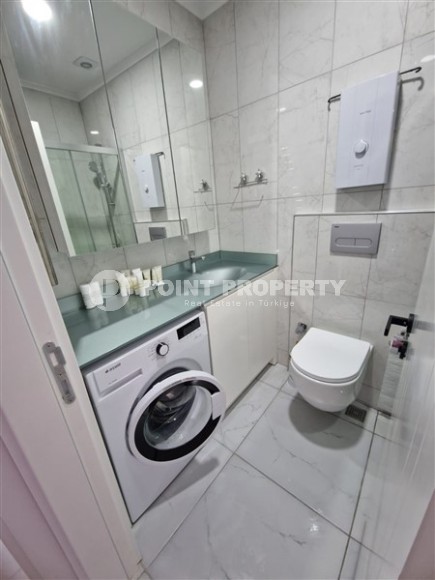 Современная, благоустроенная квартира 1+1, общей площадью 48 м2, в центре спокойного, уютного района Аланьи - Тосмур-id-7119-фото-6