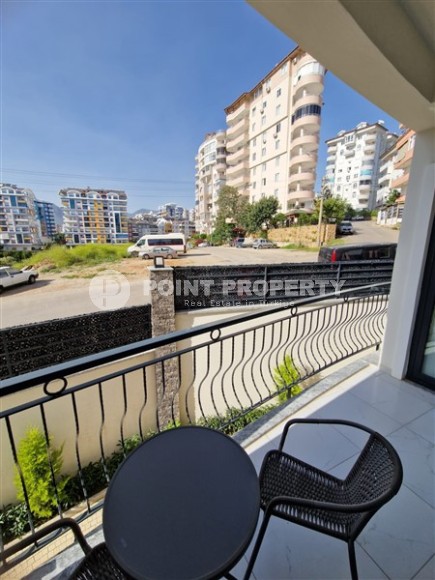 Современная, благоустроенная квартира 1+1, общей площадью 48 м2, в центре спокойного, уютного района Аланьи - Тосмур-id-7119-фото-7