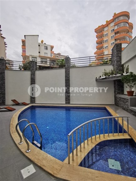 Современная, благоустроенная квартира 1+1, общей площадью 48 м2, в центре спокойного, уютного района Аланьи - Тосмур-id-7119-фото-12