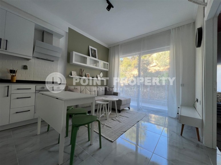 Inexpensive apartment with modern design 1200 meters from the sea, in a calm, picturesque area of Alanya - Avsallar-id-7128-photo-1