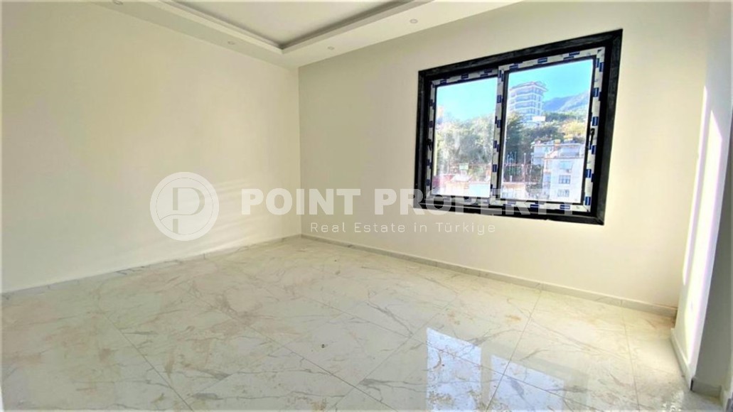 Двухуровневая квартира 2+1 с панорамным видом на Торосские горы, на 4-м этаже с мансардой в новой резиденции, введенной в эксплуатацию в 2023 году-id-7140-фото-5