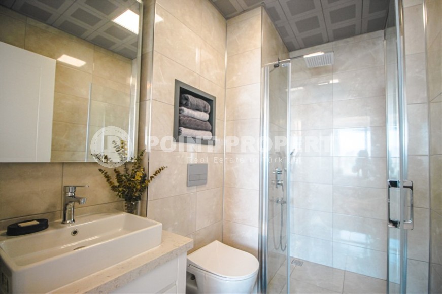 Stylish apartment with designer renovation on the first line from the sea, in the center of the modern area of Alanya - Mahmutlar-id-7149-photo-11