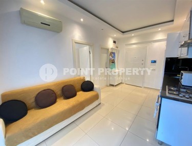 Compact 1+1 apartment, with a total area of 50 m2, in a modern residential complex in the center of Alanya-id-7173-photo-1