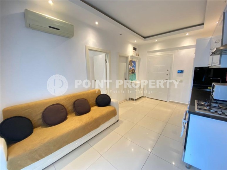 Компактная квартира 1+1, общей площадью 50 м2, в современном жилом комплексе в центре Аланьи-id-7173-фото-1