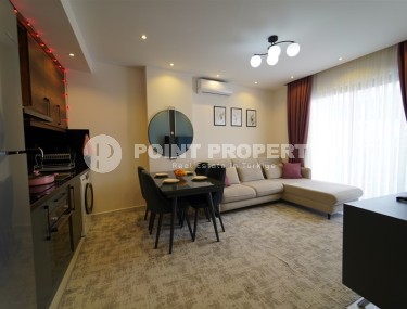 Compact 1+1 apartment with views of the city and the Taurus Mountains, on the 10th floor, 550 meters from the sea-id-7186-photo-1