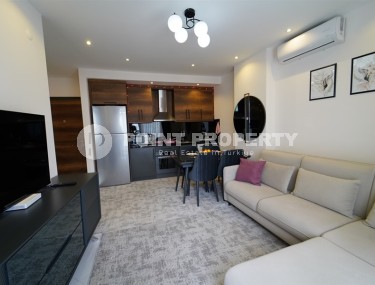 Compact 1+1 apartment with views of the city and the Taurus Mountains, on the 10th floor, 550 meters from the sea-id-7186-photo-2