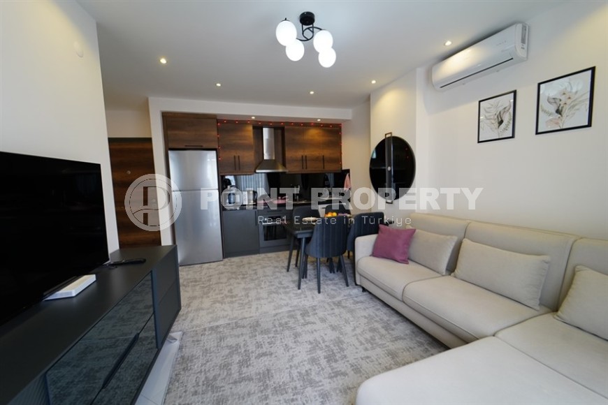 Compact 1+1 apartment with views of the city and the Taurus Mountains, on the 10th floor, 550 meters from the sea-id-7186-photo-2