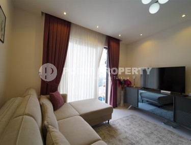 Compact 1+1 apartment with views of the city and the Taurus Mountains, on the 10th floor, 550 meters from the sea-id-7186-photo-3