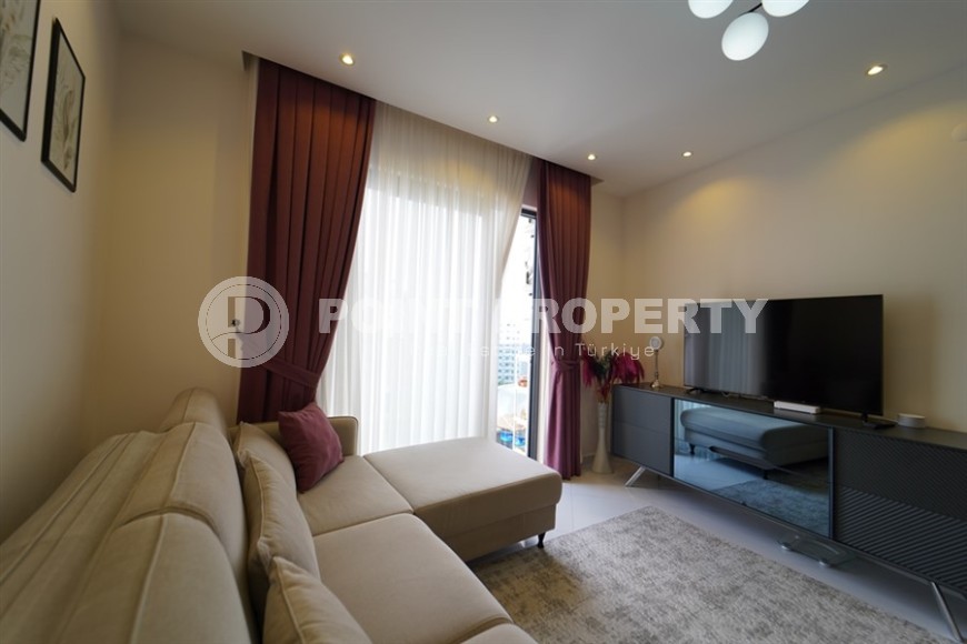 Compact 1+1 apartment with views of the city and the Taurus Mountains, on the 10th floor, 550 meters from the sea-id-7186-photo-3