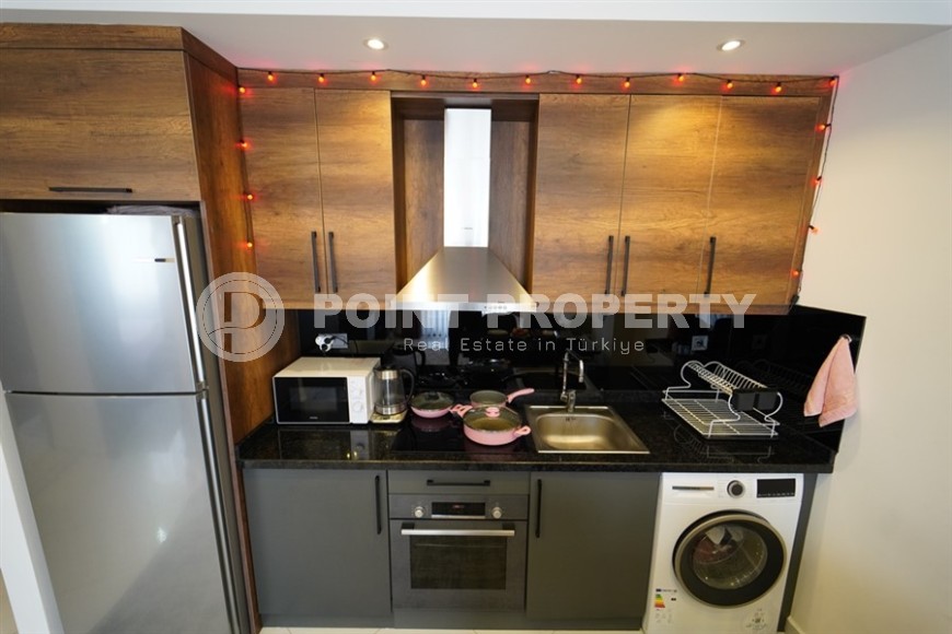 Compact 1+1 apartment with views of the city and the Taurus Mountains, on the 10th floor, 550 meters from the sea-id-7186-photo-5