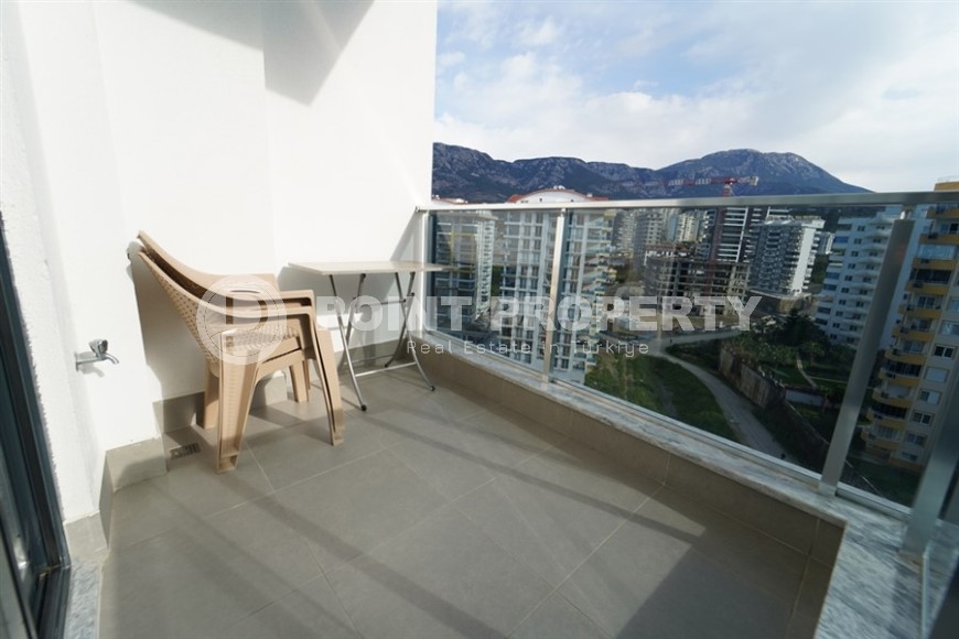 Compact 1+1 apartment with views of the city and the Taurus Mountains, on the 10th floor, 550 meters from the sea-id-7186-photo-10
