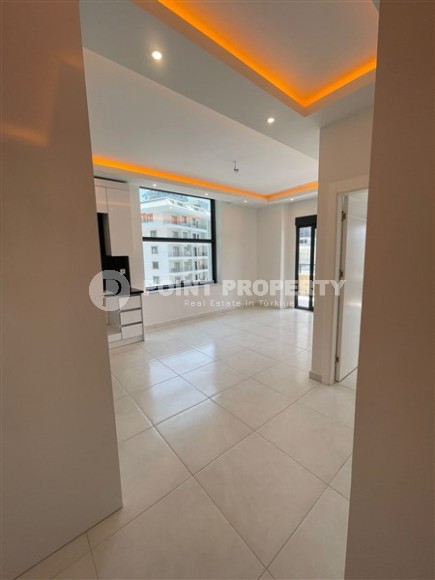 Apartment with high-quality finishing 650 meters from the sea, in the center of the modern area of Alanya - Mahmutlar-id-7189-photo-4