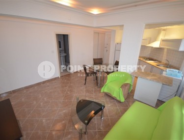 Благоустроенная меблированная квартира 1+1, общей площадью 55 м2, в центре современного района Аланьи - Нижняя Оба-id-7216-фото-2