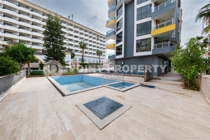 Просторная квартира 2+1 с качественным ремонтом и современным дизайном, в 50 метрах от моря, в центре района Махмутлар-id-7246-фото-2