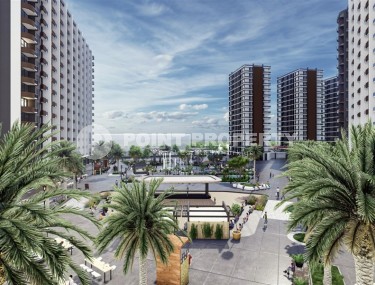A new investment-attractive project in the resort area of Mersin - Tarsus - a large-scale residential complex consisting of seven 15-storey blocks, ten kilometers from the sea-id-7251-photo-1
