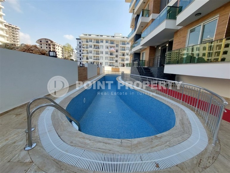 New two-room apartments at the stage of completion, Mahmutlar district-id-4337-photo-10