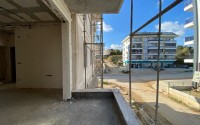 Inexpensive apartment in a residence under construction, in a promising area of Alanya - Avsallar-id-7270-photo-11