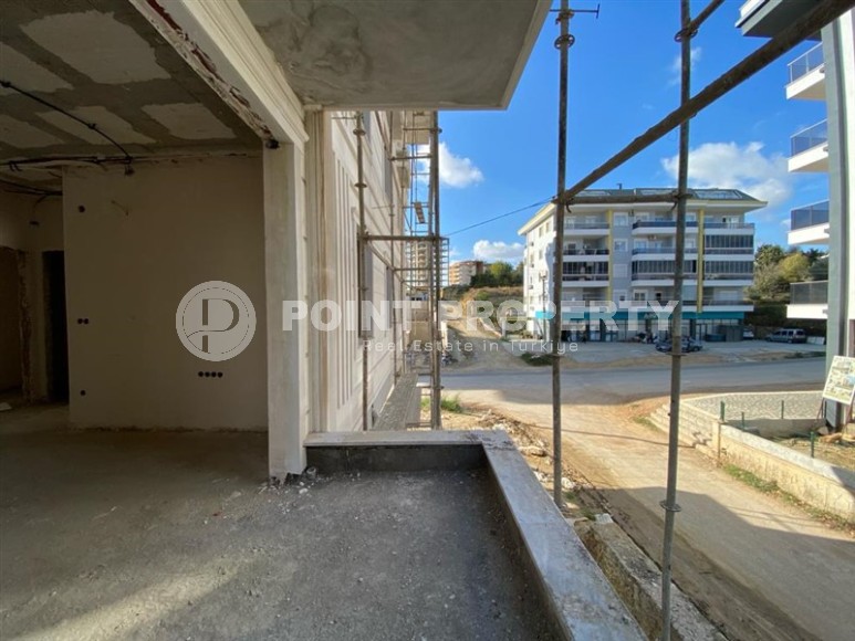 Inexpensive apartment in a residence under construction, in a promising area of Alanya - Avsallar-id-7270-photo-11