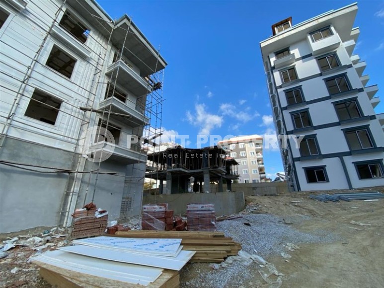 Inexpensive apartment in a residence under construction, in a promising area of Alanya - Avsallar-id-7270-photo-14