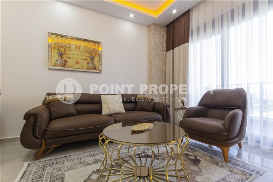 Small apartment with modern design, comfortable furniture and the latest appliances, in a popular area of Alanya - Mahmutlar-id-7273-photo-4