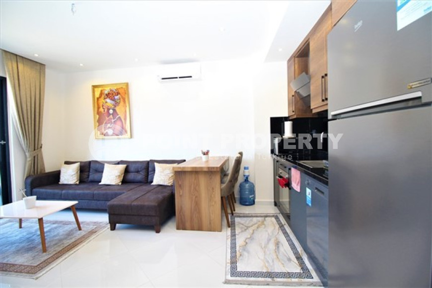 Cozy two-room apartment with an area of 60 m2, in the Mahmutlar area, 600 meters from the Mediterranean coast.-id-1565-photo-2