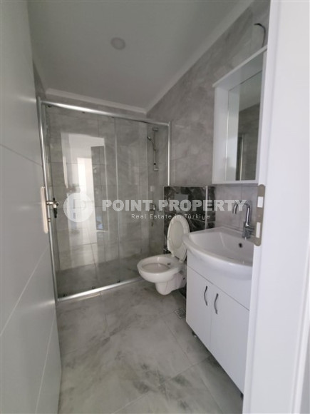 Two bedroom apartment, 90m² in a complex with a swimming pool under construction, in Alanya - Oba-id-1566-photo-5