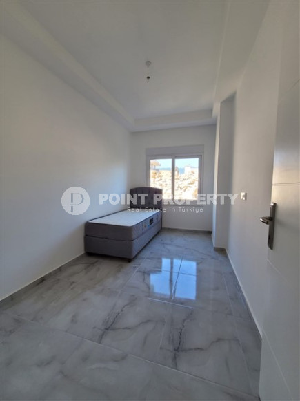 Two bedroom apartment, 90m² in a complex with a swimming pool under construction, in Alanya - Oba-id-1566-photo-6
